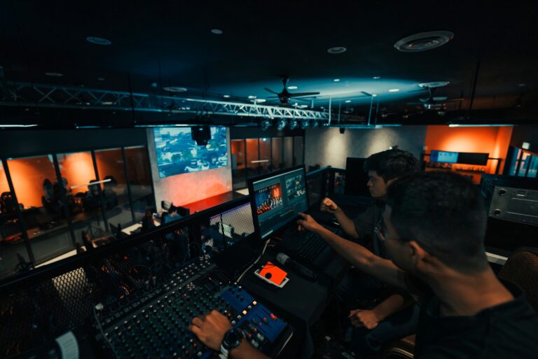 AV technician operating an audio mixing console for a live event production